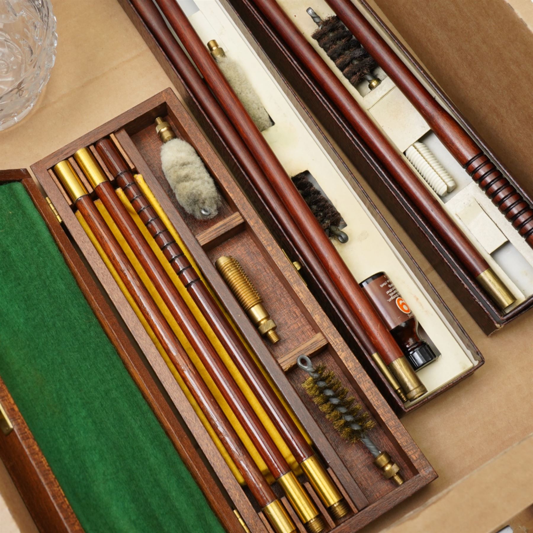 Two Parker Hale shotgun cleaning kits, another cleaning kit in wooden case and a glass jug