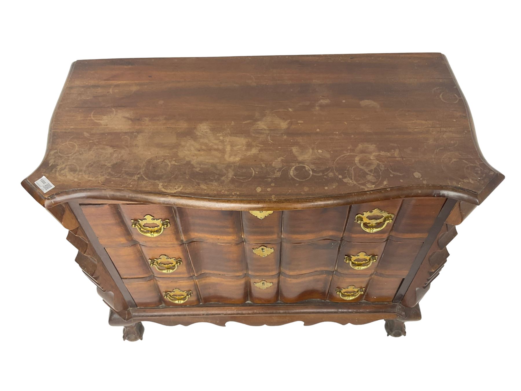 19th century Dutch serpentine chest, moulded edge, fitted with three drawers with shaped fronts and brass handle pulls, flanked by shaped uprights and panelled sides, raised on cabriole supports terminating in ball and claw feet