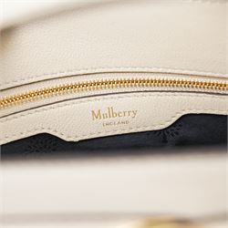 Mulberry - Islington handbag in Chalk Silky Calf leather with black piping, the structured body with single rolled top handle, gold-tone Postman’s Lock fastening and front strap detail, with detachable and adjustable shoulder strap, opening to a spacious two-division interior with Mulberry monogram fabric lining, with original Mulberry product tag, care booklet and dust bag, unused
