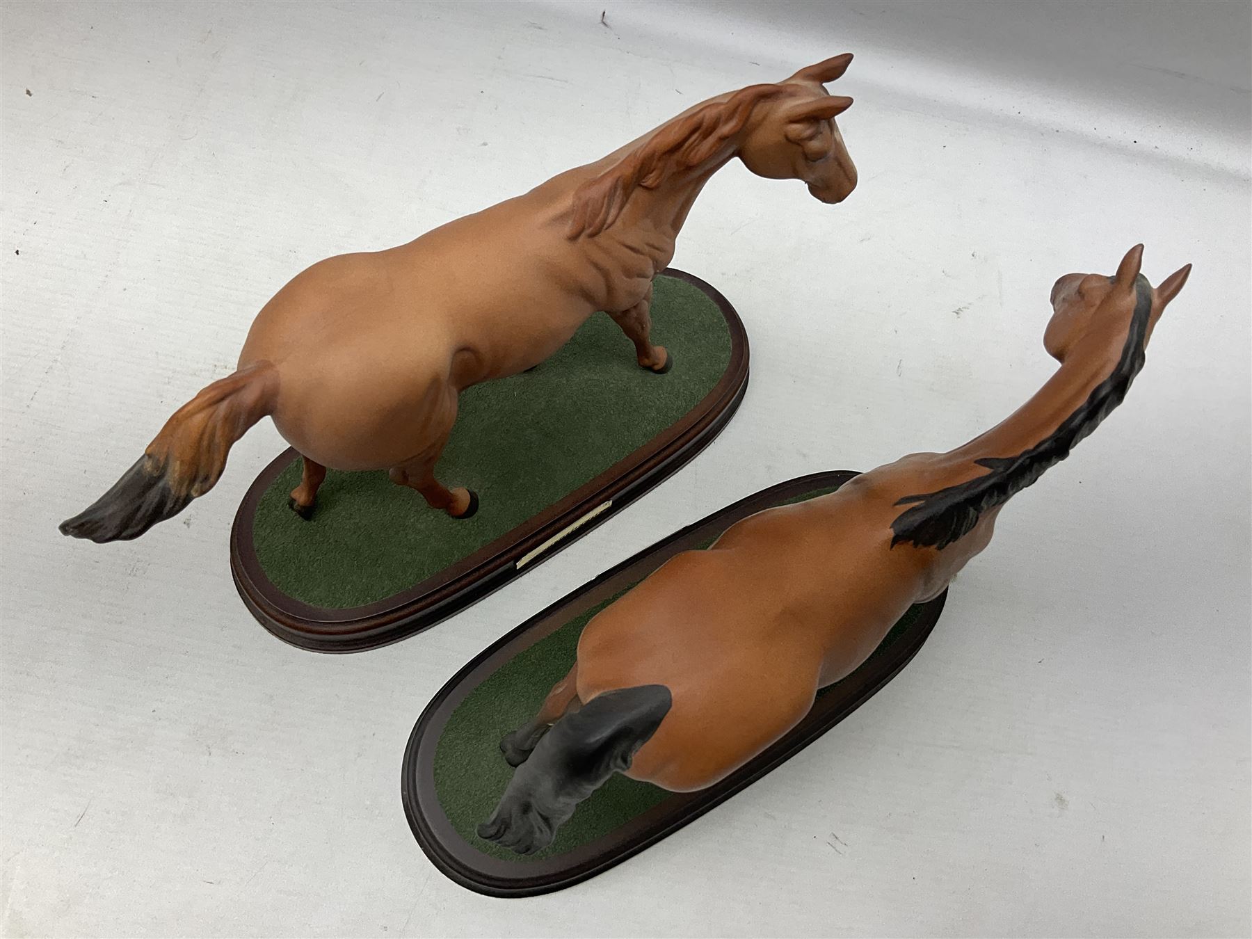 Collection of Beswick horse figures, to include Red Rum on a wooden plinth,  Lammtarra on oval plinth, Morgan Horse Black and three others, together with Royal Daulton Appaloosa Foal and a USSR horse