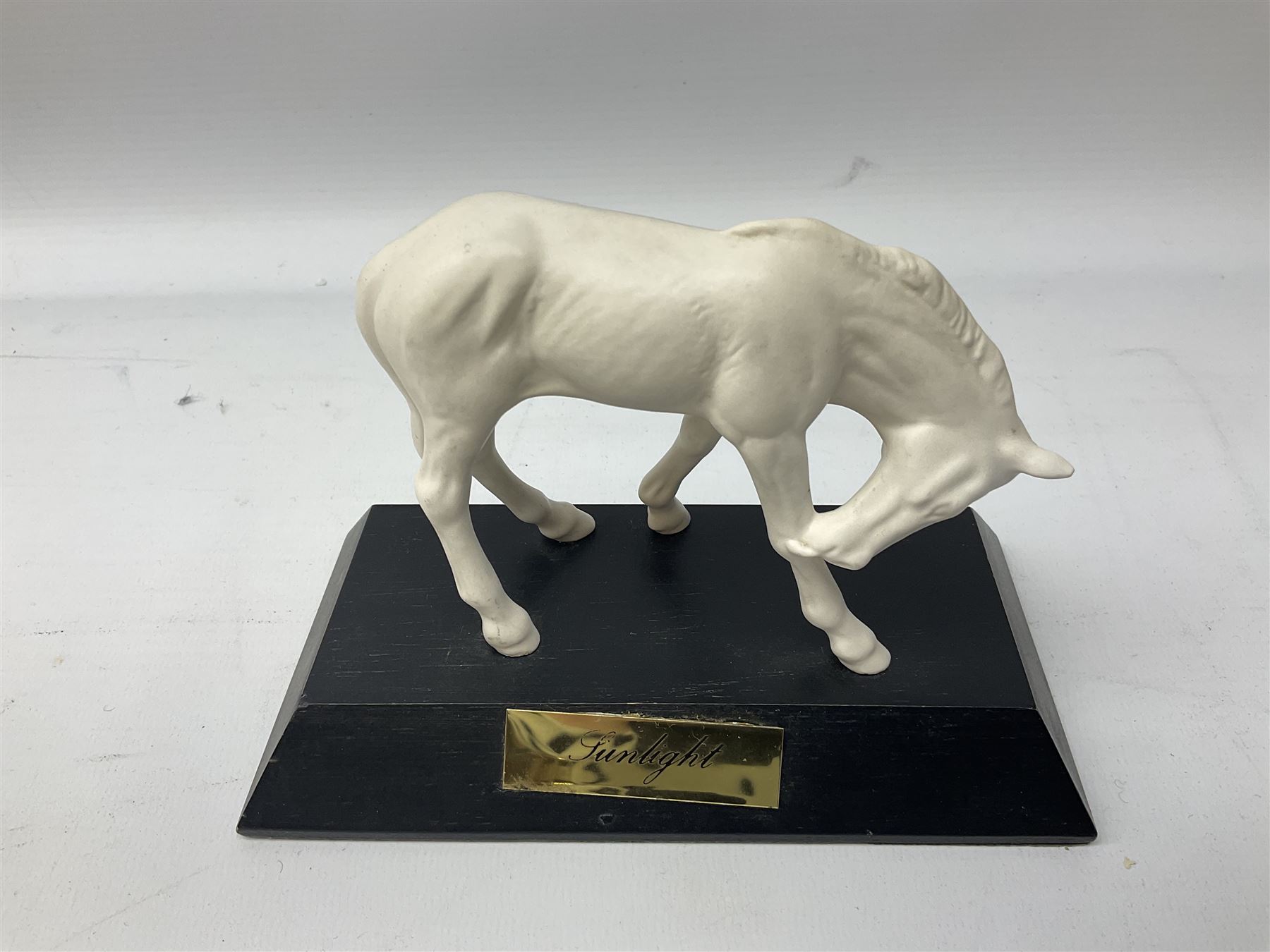 Collection of Beswick horses, including grey horse no.701, palomino foal no 836, grey stocky jogging mare no.855 etc, together two Royal Doulton horses, (8)