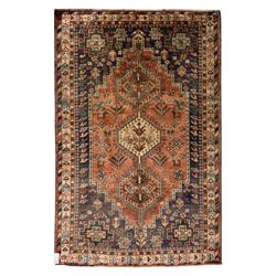 South West Persian Qashqai hand-knotted rug, salmon pink field with central stepped geomet...