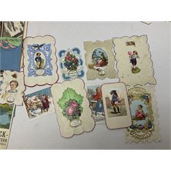 Early 20th century ephemera, to include signed photographs of Charles Boyer and Walter Pidgeon etc, a printed letter from Winston Churchill, two albums and a quantity of transfer books of Players and similar cigarette cards, including Boy Scout and Girl Guide Patrol Signs and Emblems and RAF Badges, a collection of greetings cards and postcards, a photograph album containing black and white photographs of Caius College Cambridge and guides and pamphlets on travelling Switzerland and the UK