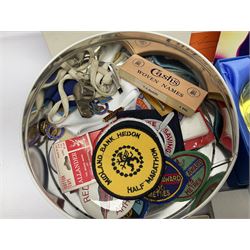 Two hallmarked silver fobs, three continental silver souvenir spoons, four Meka Denmark year spoons, a collection of patches, postcards, Sadlers Wells theatre ephemera and collectables including programs and paperweights and other collectables