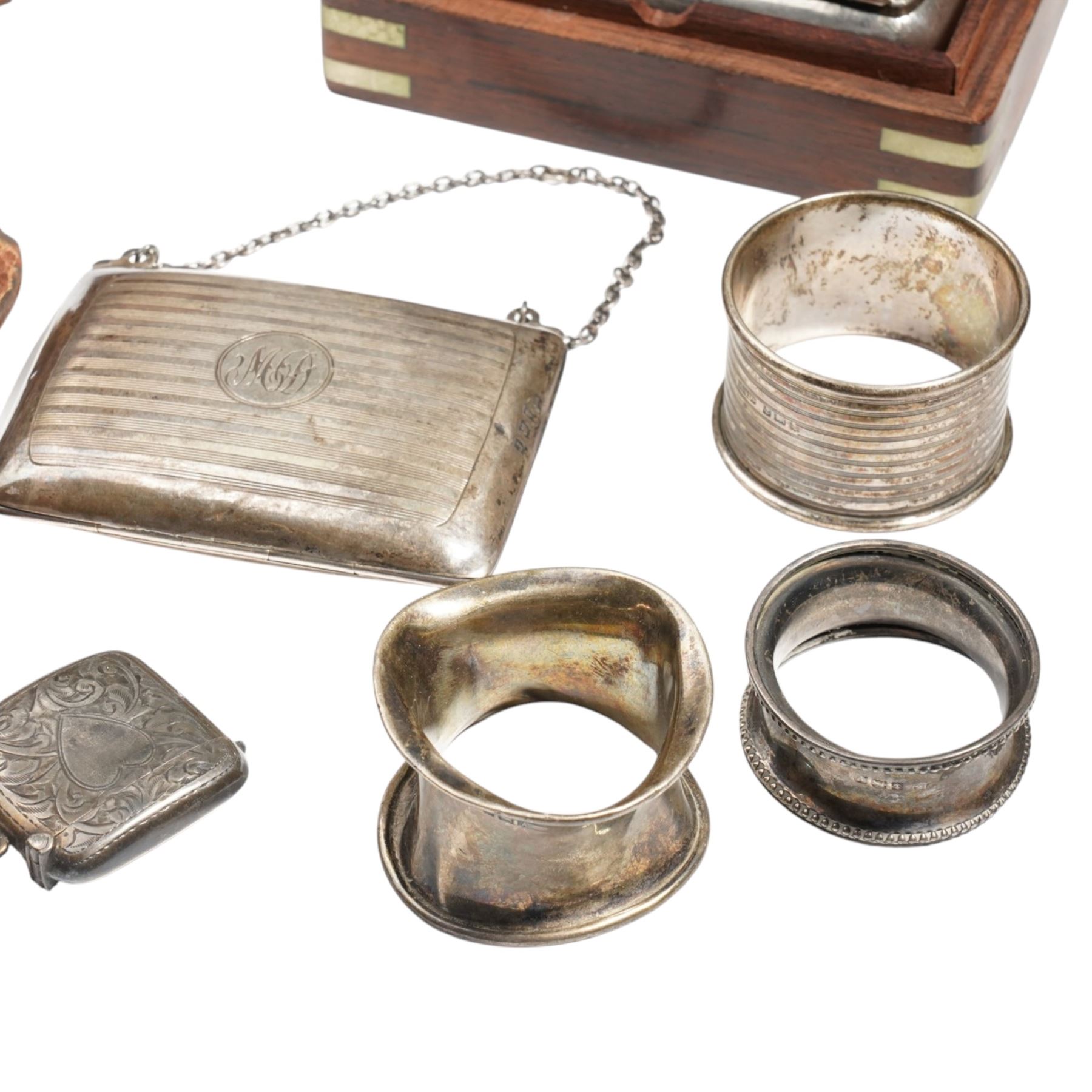 Collection of silver items including purse, three napkin rings, two vesta cases, silver cheroot holder case etc