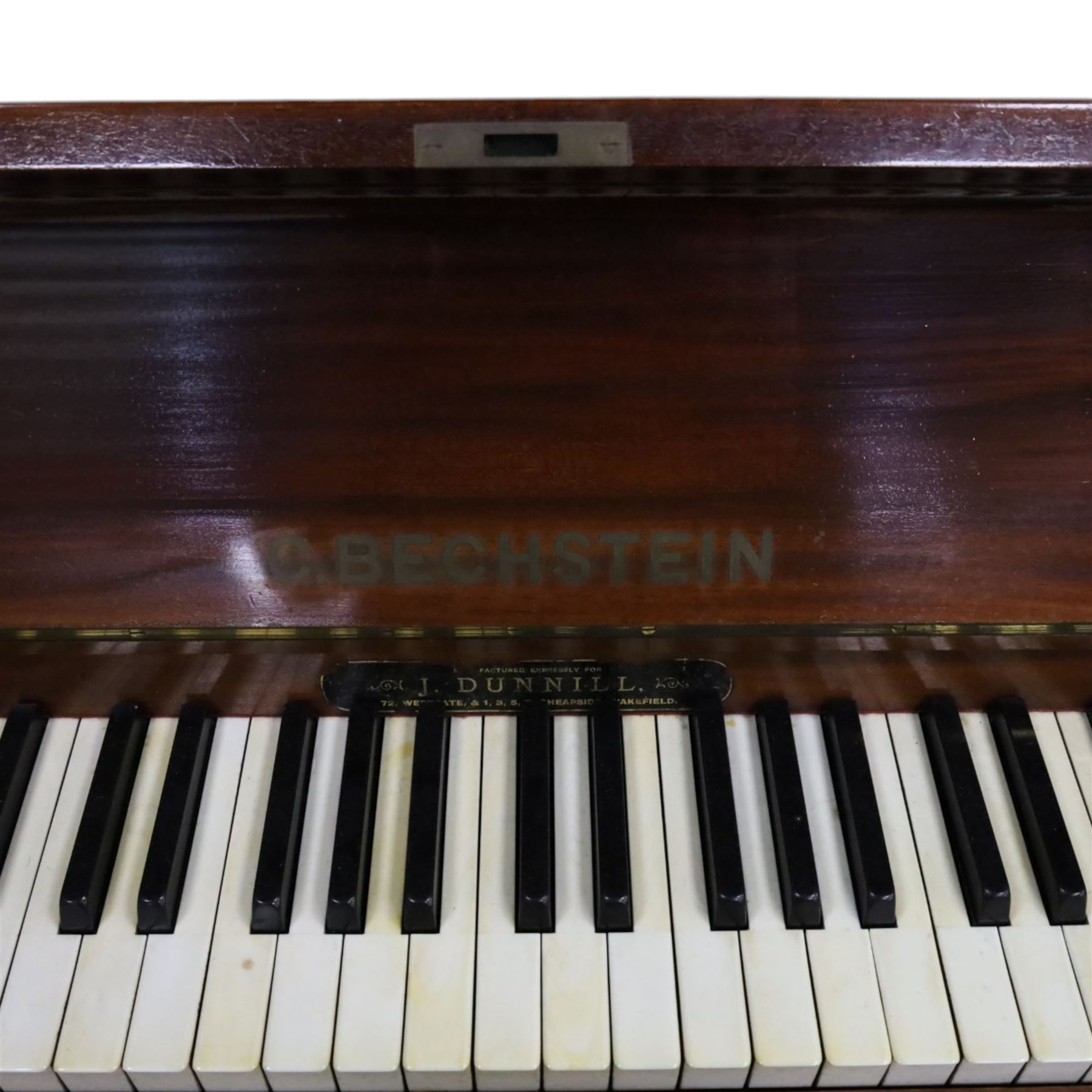 Edwardian C. Bechstein mahogany cased upright piano, with ivory keys and two pedals, manufactured expressly for J Dunnill Wakefield, serial no. , H123cm, W150cm