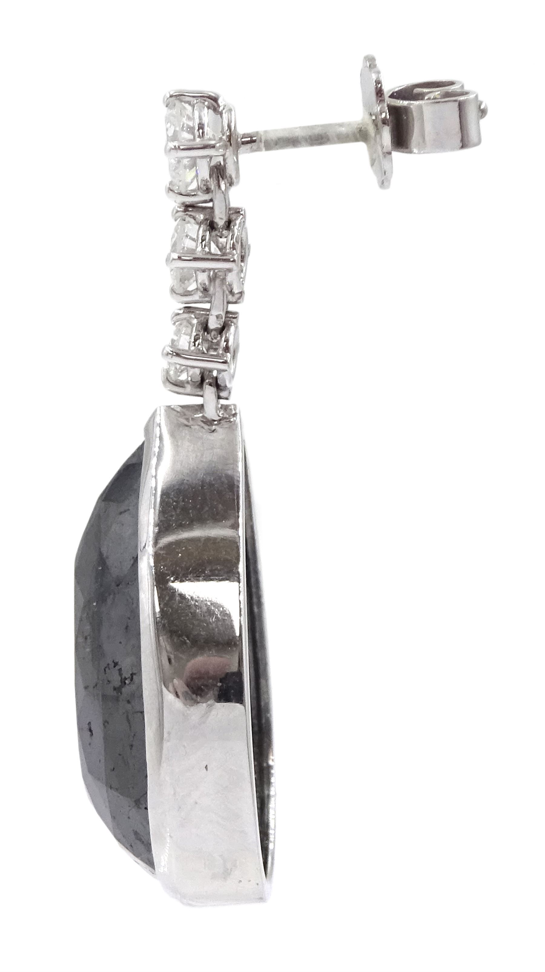 Pair of 18ct white gold black and white diamond pendant stud earrings, three graduating round brilliant cut diamonds suspending a single pear cut black diamond, hallmarked, total white diamond weight approx 1.05 carat, total black diamond weight approx 43.65 carat 