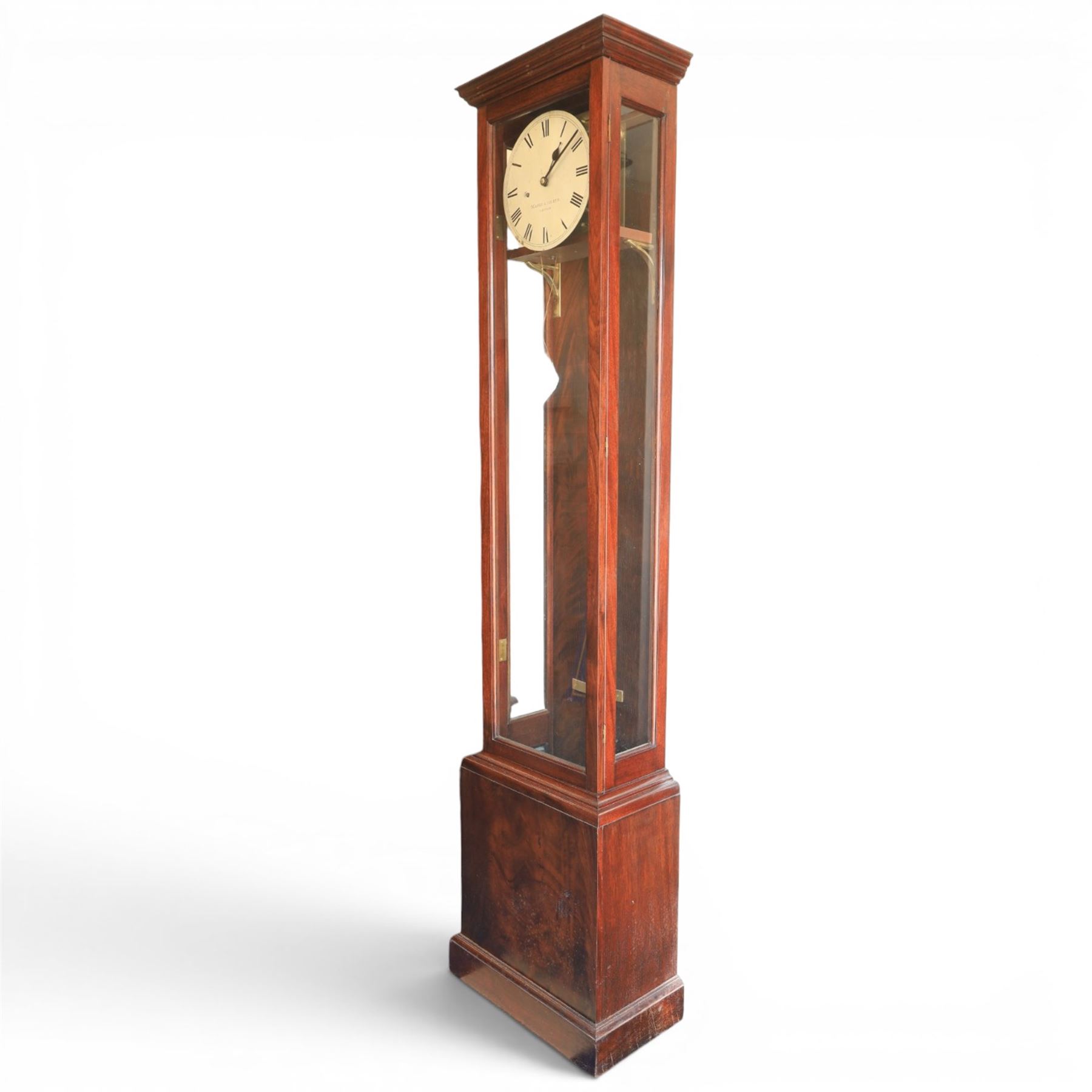 Edwardian mahogany regulator longcase clock, retailed by Maple & Co. Ltd., London, moulded cornice over glazed case enclosing a circular painted Roman numeral dial, single train weight-driven movement with brass cased weight and pendulum, on plinth base
