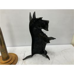 Cast iron doorstop modelled as a Scottie dog, brass model of a bull, brass model of a blacksmith and a brass shell converted into a table lamp on circular wooden base