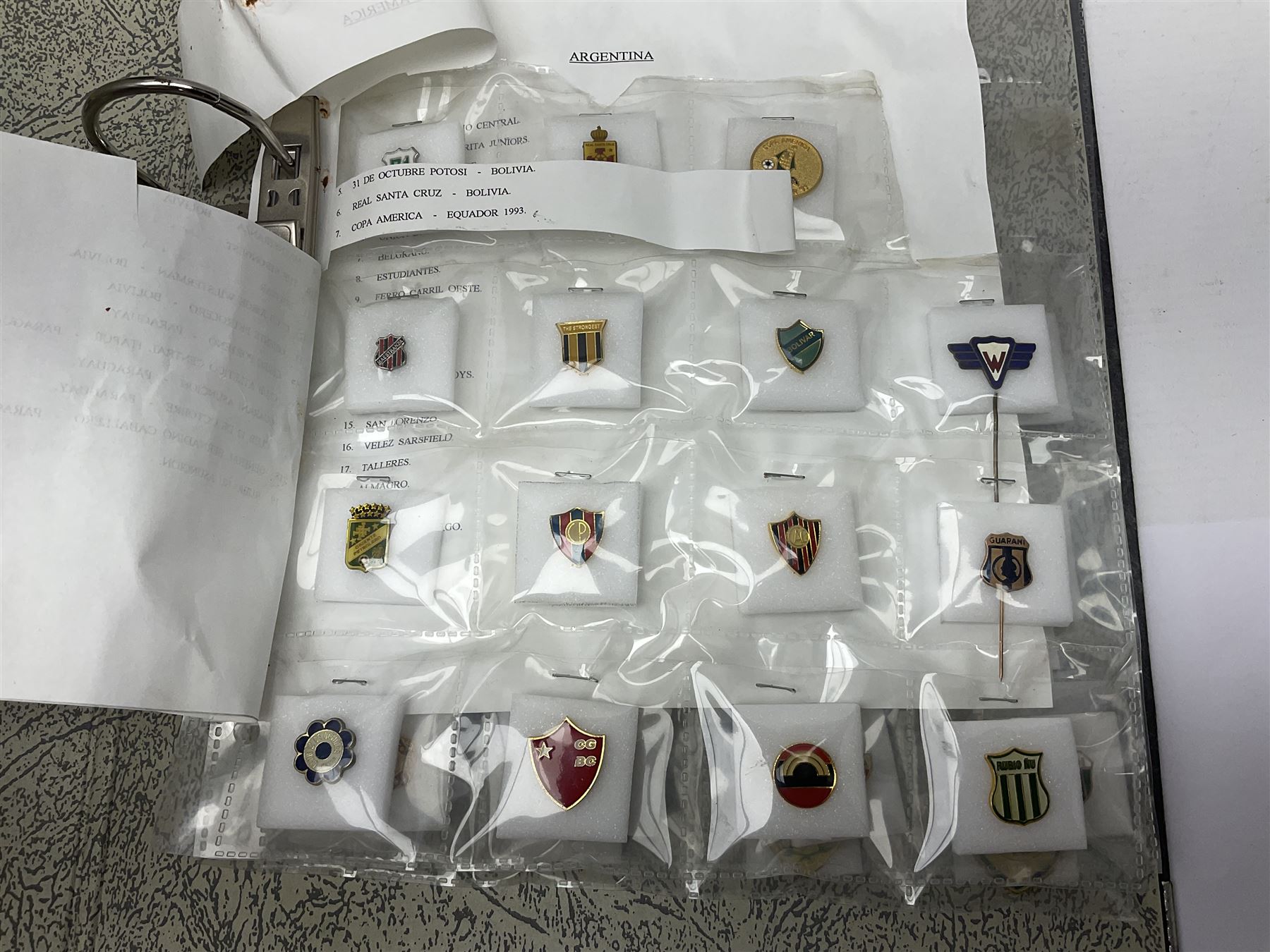Large collection of approximately one hundred and eighty enamel badges and pins, relating to British and World football clubs, including loose examples and examples housed in folders, mostly identified