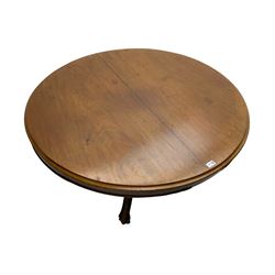 Victorian mahogany breakfast table, circular tilt-top with moulded edge, lobe carved baluster pedestal with three splayed supports, floral carvings to knees and scrolled terminals, on metal castors