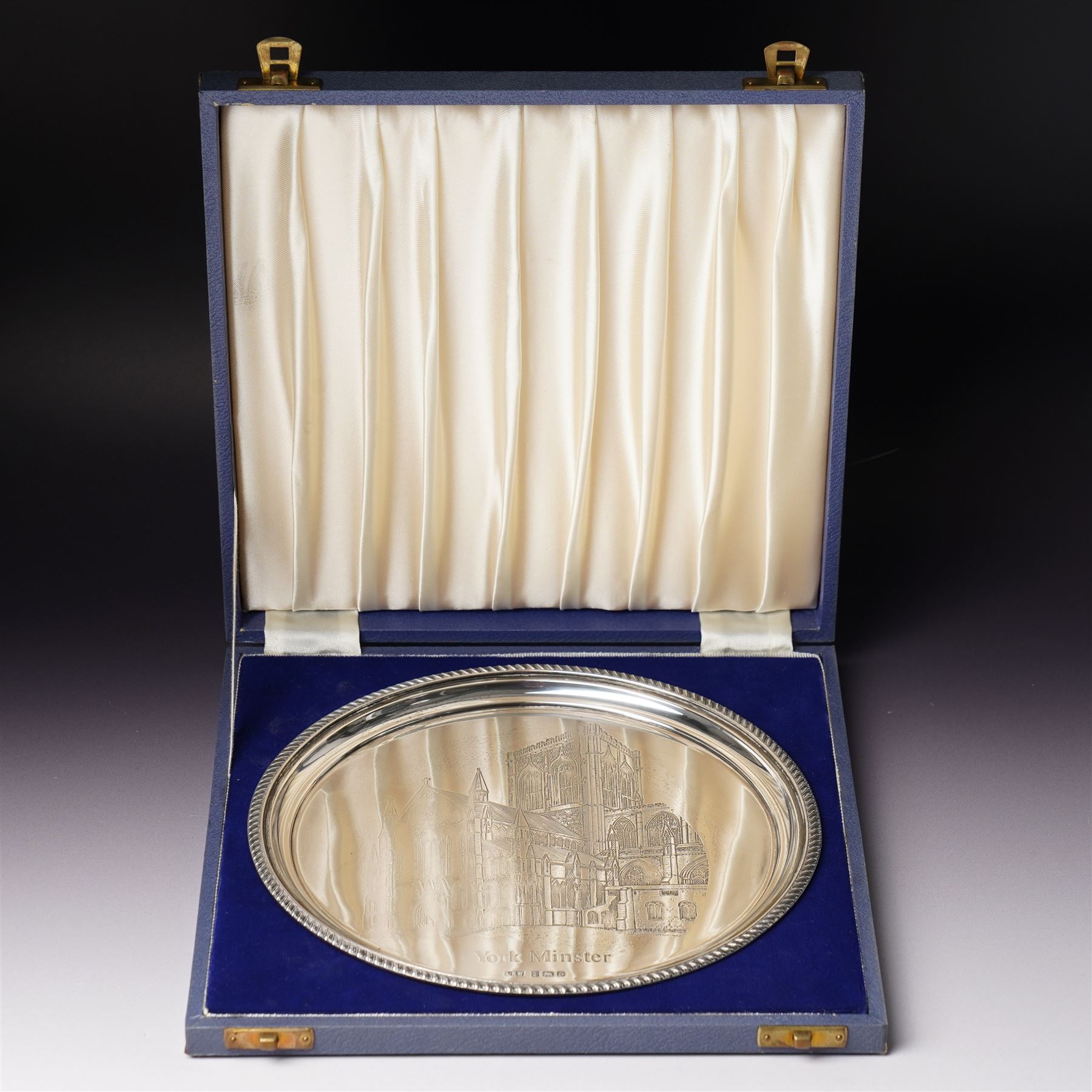 Silver circular York Minster salver with gadrooned border engraved with a view of the Minster in case D21cm Birmingham 1979 Maker Laurence Watson & Co