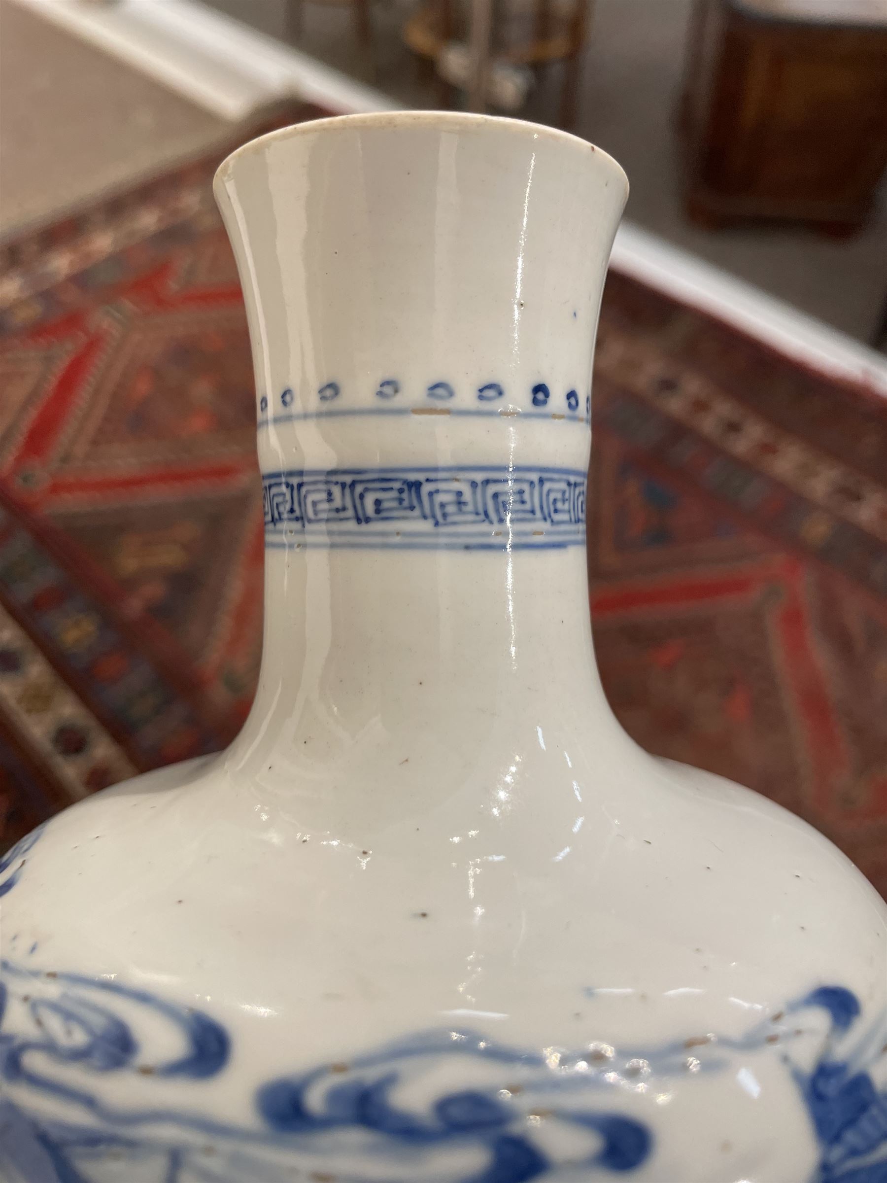 Chinese Kangxi porcelain vase, of baluster form painted in underglaze blue with seated figures and attendants, with fence, rockwork and leafy bamboo branches, with concentric circles mark beneath, H22.5cm