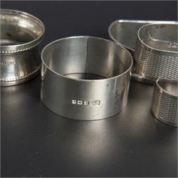 Five silver napkin rings, including pair of 1930s oval examples, with engine turned decoration with engraved initial, together with a collection of silver flatware, including Norwegian spoon, pair of Fiddle pattern mustard spoons, five seal top coffee spoons, etc, all stamped or hallmarked