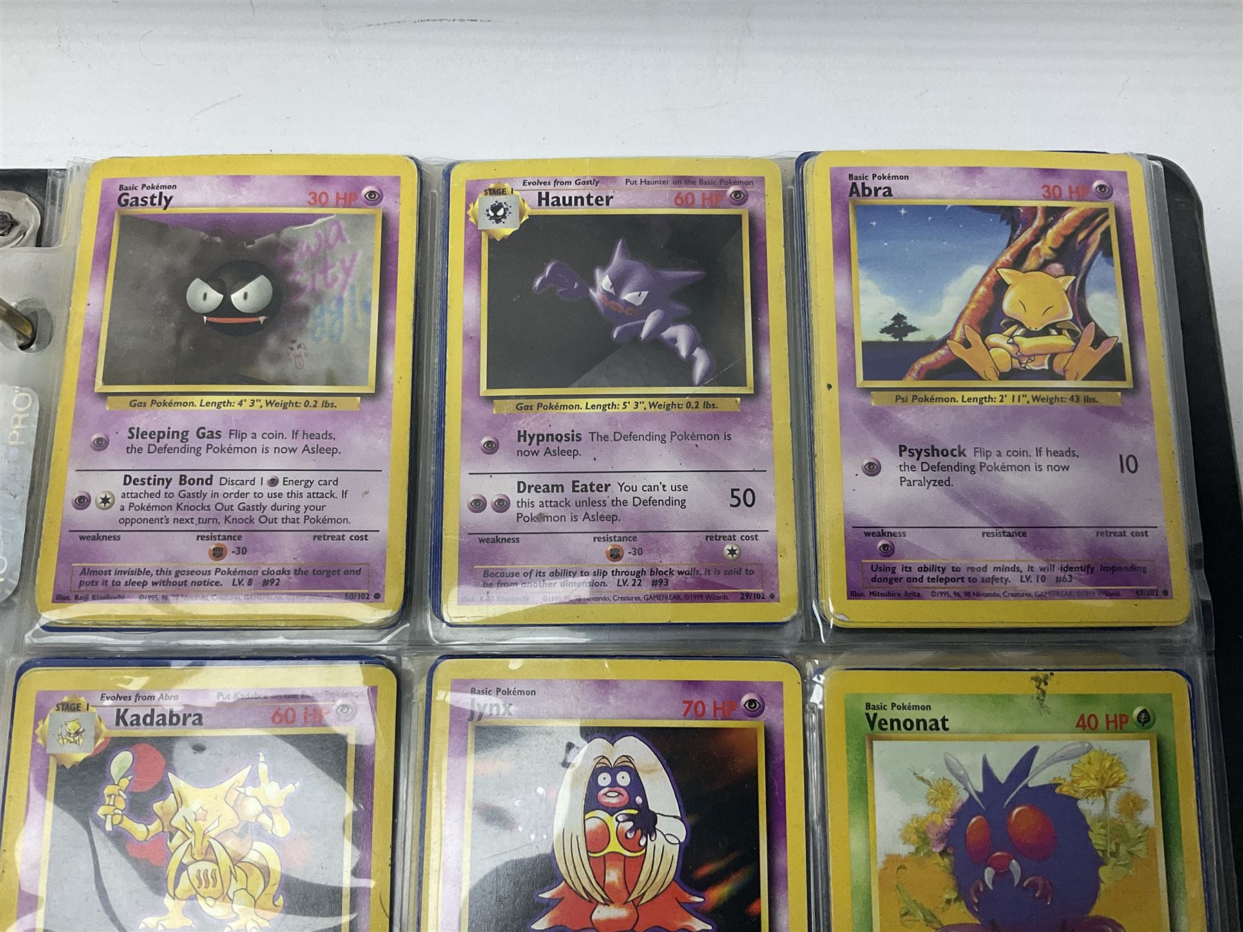 Collection of Pokemon trading cards, mostly 1999 Wizards Pokemon cards to include holo Charizard 4/102, first edition holo Machamp 8/102, further holographic cards; Dark Flareon 35/82 and Dark Vaporeon 45/82, cards from themed sets and 4th edition prints; 1998 Electronic Pokédex with cardboard boxes for themed decks Blackout, Overgrowth and Power Reserve Jungle, along with a large quantity of energy and trainer cards 
