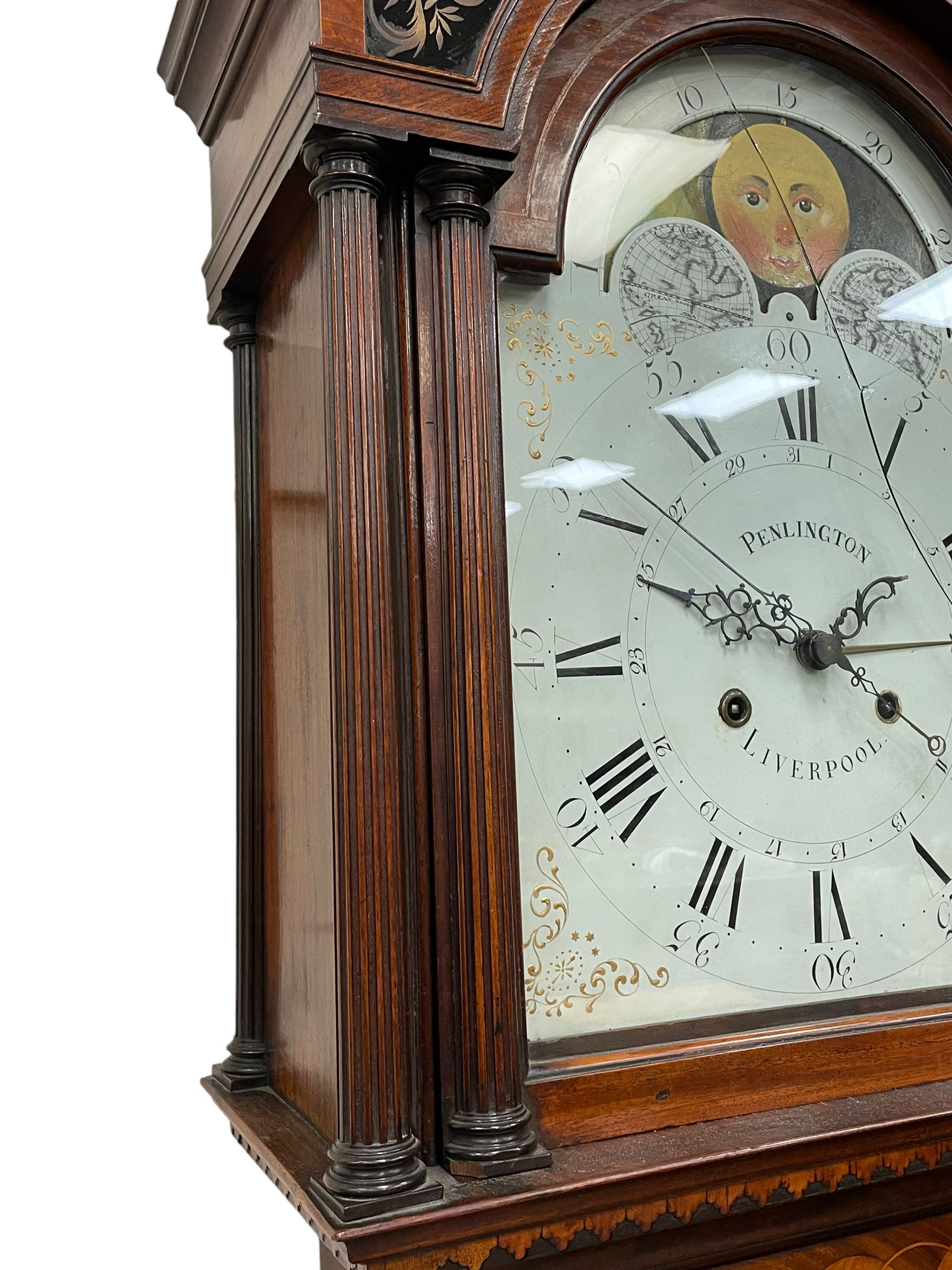 Penlington of Liverpool – early 19th century 8-day mahogany longcase clock, swans neck pediment with three turned wooden finials and verre eglomise panels, trunk with reeded columns and wavy topped door, plinth with canted corners on bracket feet, painted break-arch dial with Roman numerals and five-minute Arabic’s, centre sweep calendar and seconds hands, blue steel serpentine hands, signed beneath a painted rolling moon in the arch PENLINGTON, LIVERPOOL, eight day four pillar movement, anchor escapement and rack striking on a bell. With pendulum and weights.  The Penlington family were prolific clockmakers in 19th century Liverpool working from several addresses in the city, also recorded as chronometer and chronograph makers.
