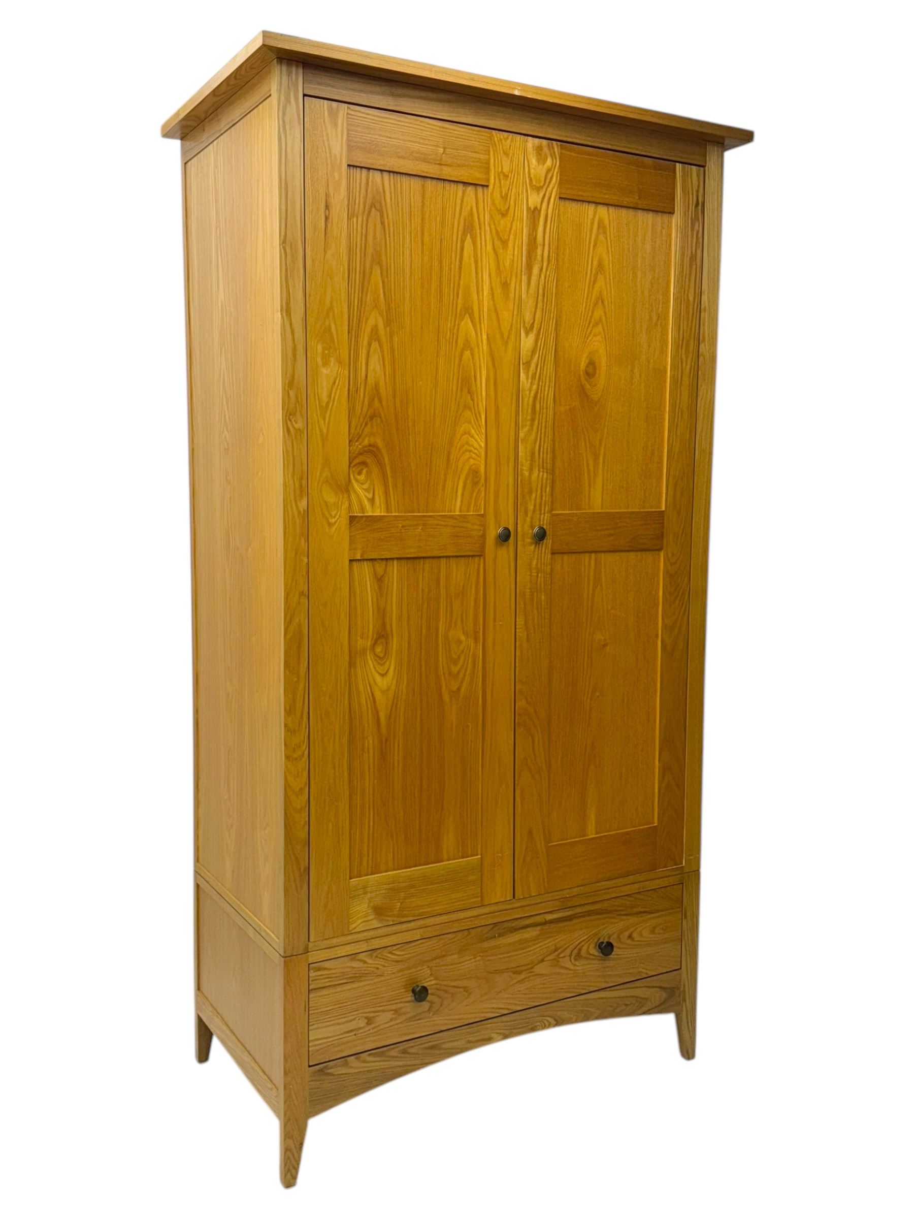 Light oak wardrobe, adjustable clothes rail and single shelf above a single drawer on squared splayed legs