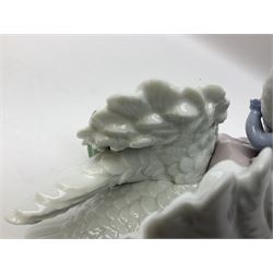 Lladro figure, Swan Song, modelled as a girl sat on a swan, in original box, no 5704, year issued 1990, year retired 1995, H19cm  