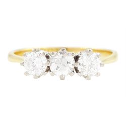 Gold diamond three stone ring, each eight claw set with round cut diamonds, stamped 18ct, ...