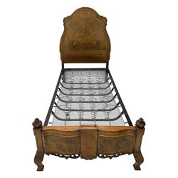 Mid-20th century walnut single bedstead, high shaped headboard, footboard with turned finials and scrollwork carvings, complete with 'Vono' iron frame, raised on cabriole supports