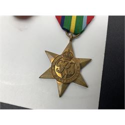 Representative display of WWII Campaign stars comprising 1939-1945 Star, Atlantic Star, Air-Crew Europe Star, Africa Star and Pacific Star; together with the corresponding group of miniatures; all with ribbons