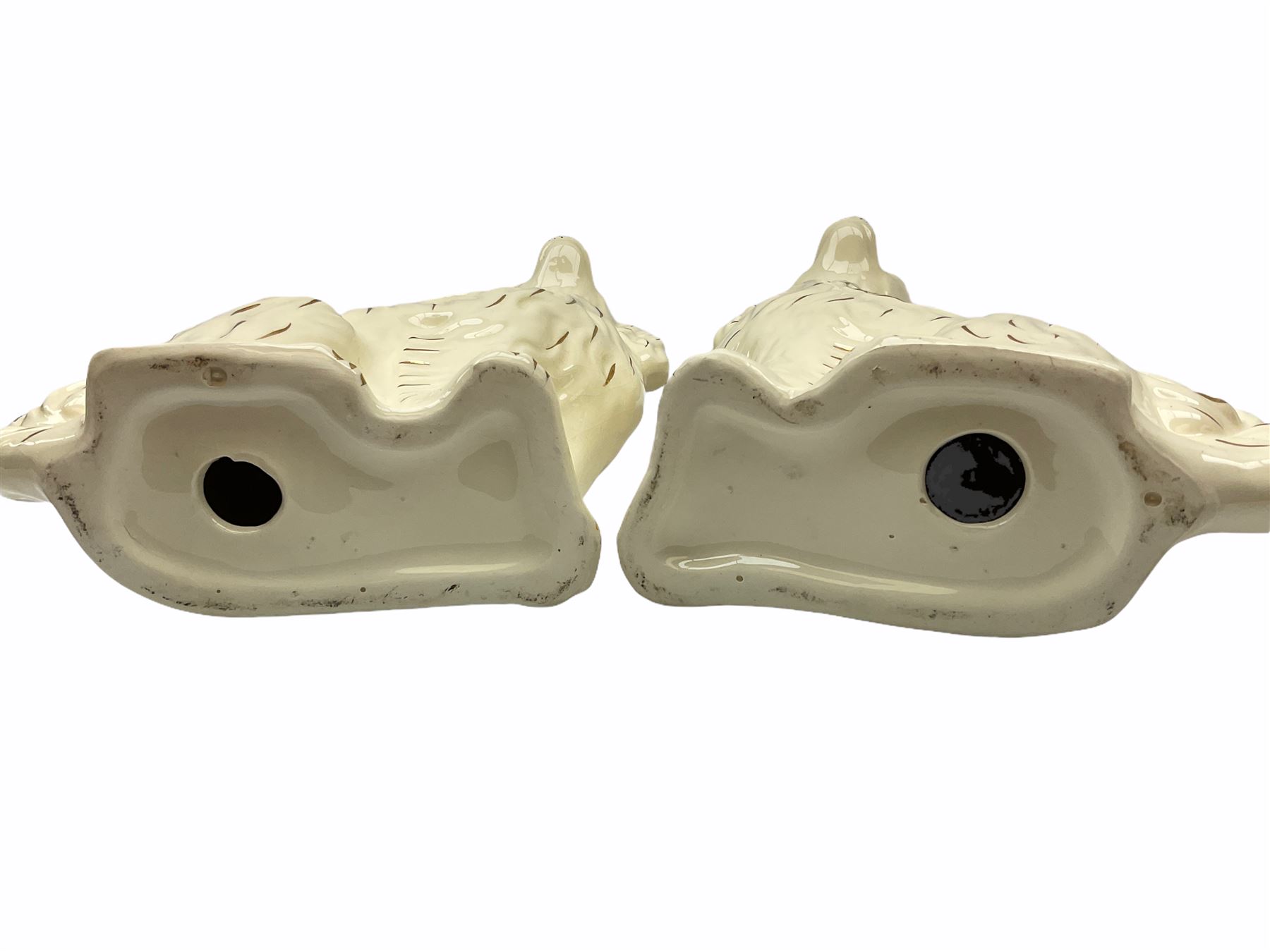 Beswick fireside Yorkshire terrier dog model no 2377 H25.5cm, together with a pair of staffordshire style white spaniels H30cm, two Mella ware terriers etc.  