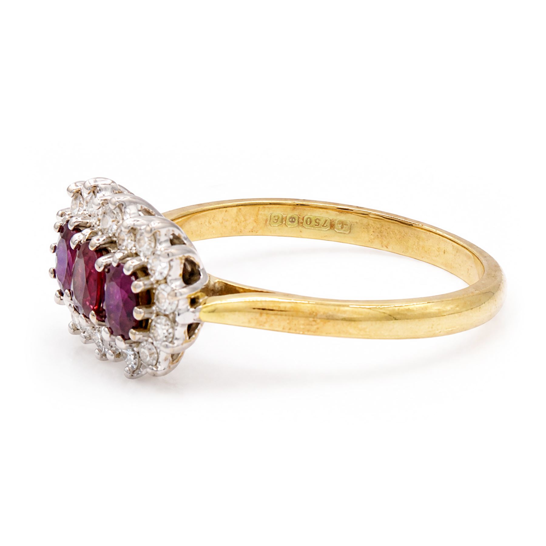 18ct gold ruby and diamond cluster ring, three oval cut rubies surrounded by eighteen single cut diamonds, London 1979, total ruby weight approx 0.55 carat, total diamond weight approx 0.20 carat