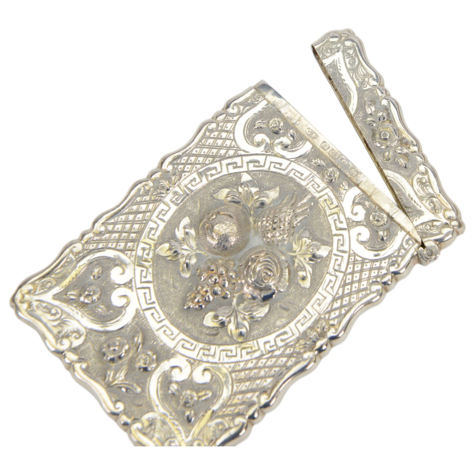 Victorian silver card case, of rectangular form with shaped borders, relief embossed with fruit and flowers and engraved with monogram, hallmarked George Unite & Sons, Birmingham 1875, H9.5cm, contained within fitted tooled leather case