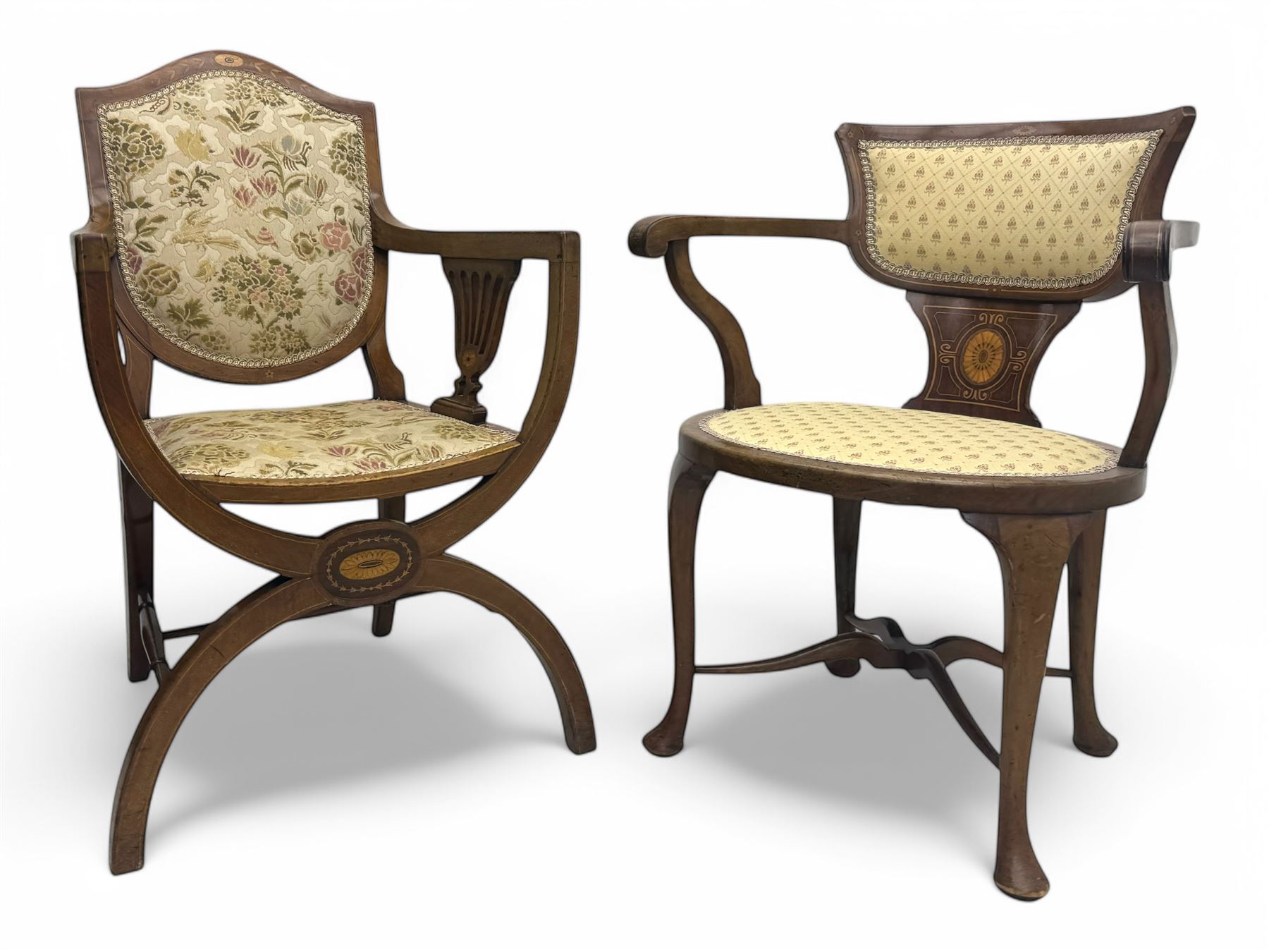 Edwardian inlaid mahogany X-frame armchair, upholstered seat and shield-back, curved front supports united by turned H-stretcher (W57cm, D58cm, H94cm); similar inlaid mahogany armchair, raised on cabriole supports united by cross-stretcher (W62cm, D60cm, H82cm) 