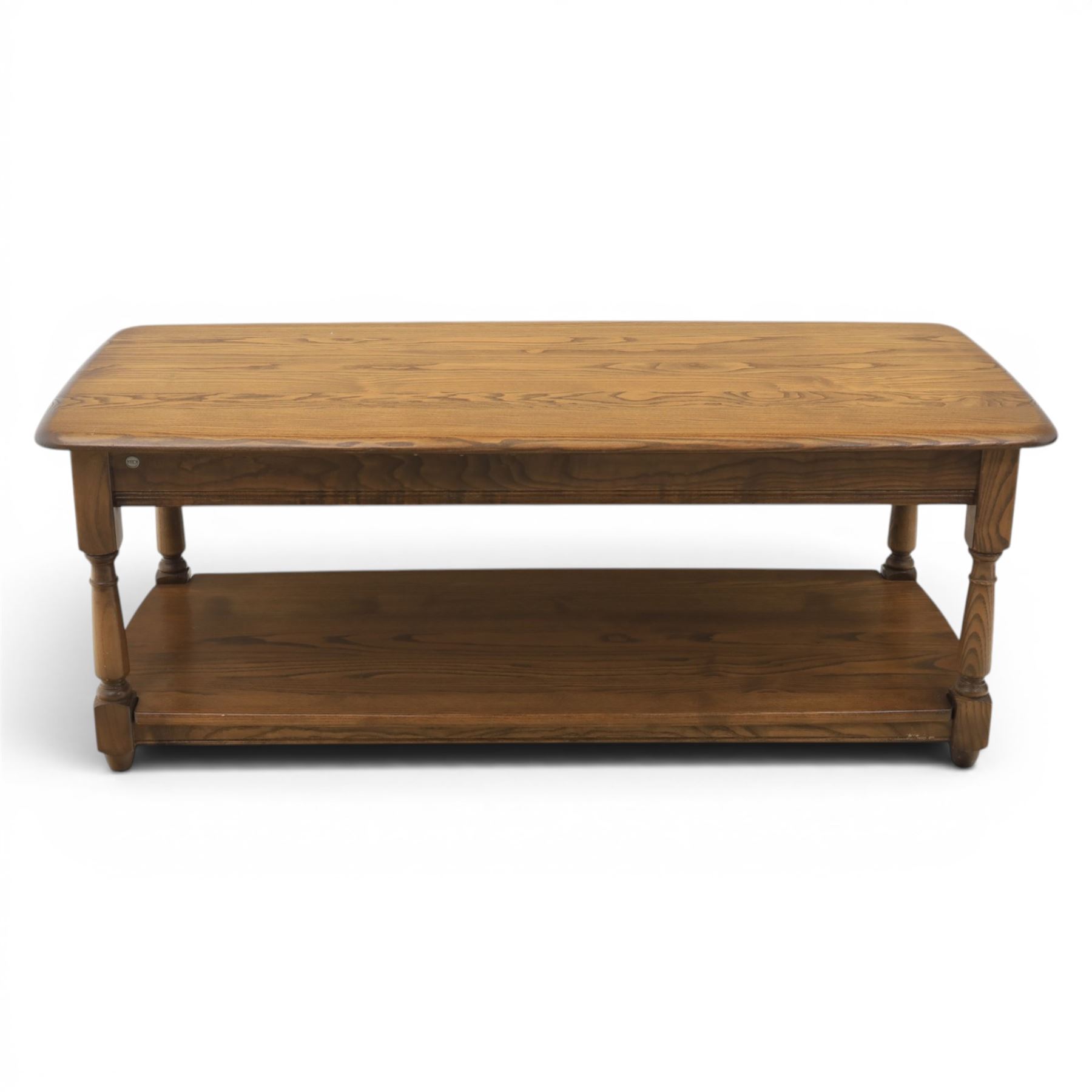 Ercol -  dark elm corner TV stand and coffee table, TV stand with drop triangular leaf, over open recess above a single drawer (H 47cm, D 44cm with leaf 79cm, W 73cm,  the coffee table with chamfered rectangular top with full length undertier, raised on turned supports (H 43cm, D 54cm, W 115cm) 