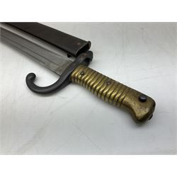French model 1866 sabre bayonet, the 57.5cm curving blade marked St. Etienne 1868; in associated steel scabbard L71cm overall