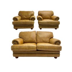 Two seat sofa (W160cm), and pair matching armchairs (W108cm), upholstered in a studded tan leather, with turned feet
