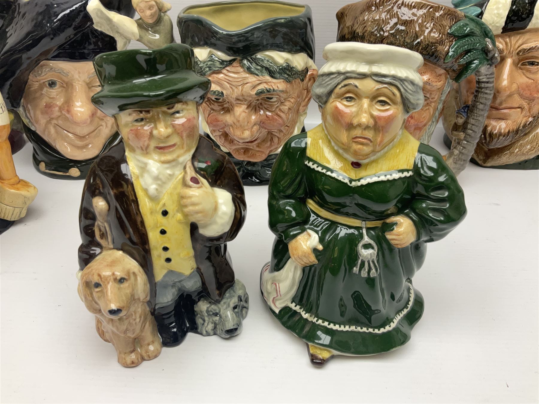Large collection of Royal Doulton character jugs, to include Robinson Crusoe D6532, Tam O Shanter D6632, The Falconer D6533 etc, together with similar charater jugs and toby jugs   