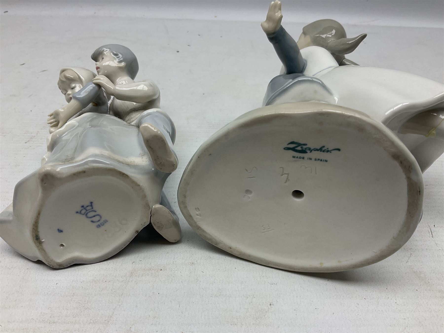 Three Nao figures comprising The Next Dance 1201 and Girls First Communion 0236, and young girl wearing a hat, together with two further Spanish style figures