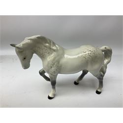 Collection of Beswick horses, including grey horse no.701, palomino foal no 836, grey stocky jogging mare no.855 etc, together two Royal Doulton horses, (8)