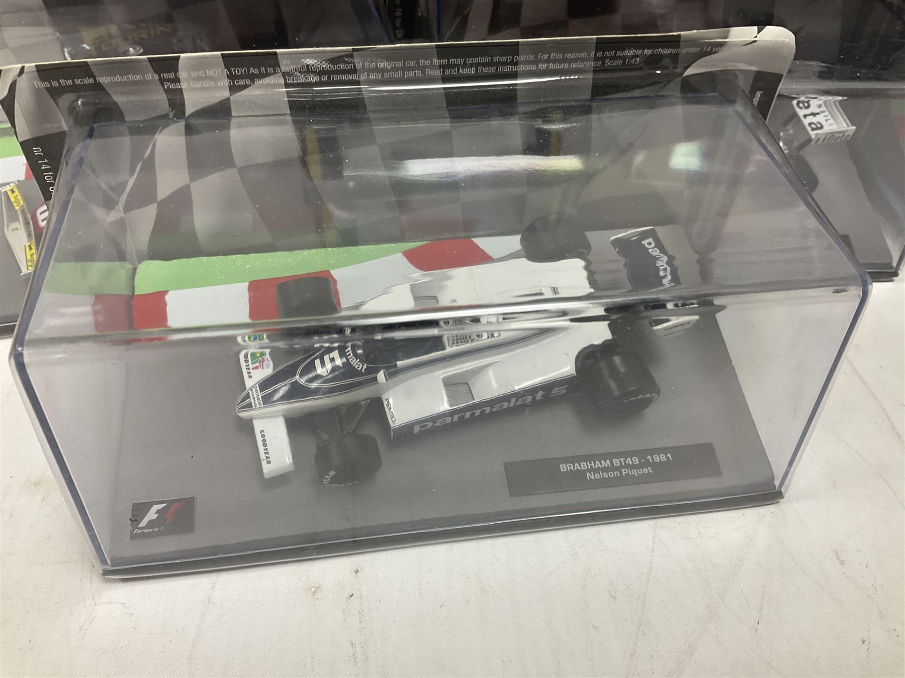 Panini Formula 1 The Car Collection - twelve blister packed racing cars and quantity of periodicals; nine mostly unopened Atlas Editions British Touring Car Champions; and six other boxed/blister packed die-cast models of racing cars