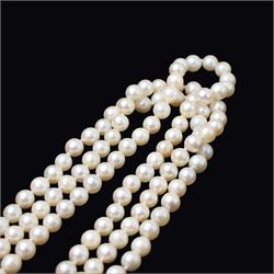 Three strand cultured white / cream pearl necklace, with an 18ct gold diamond set leaf design clasp