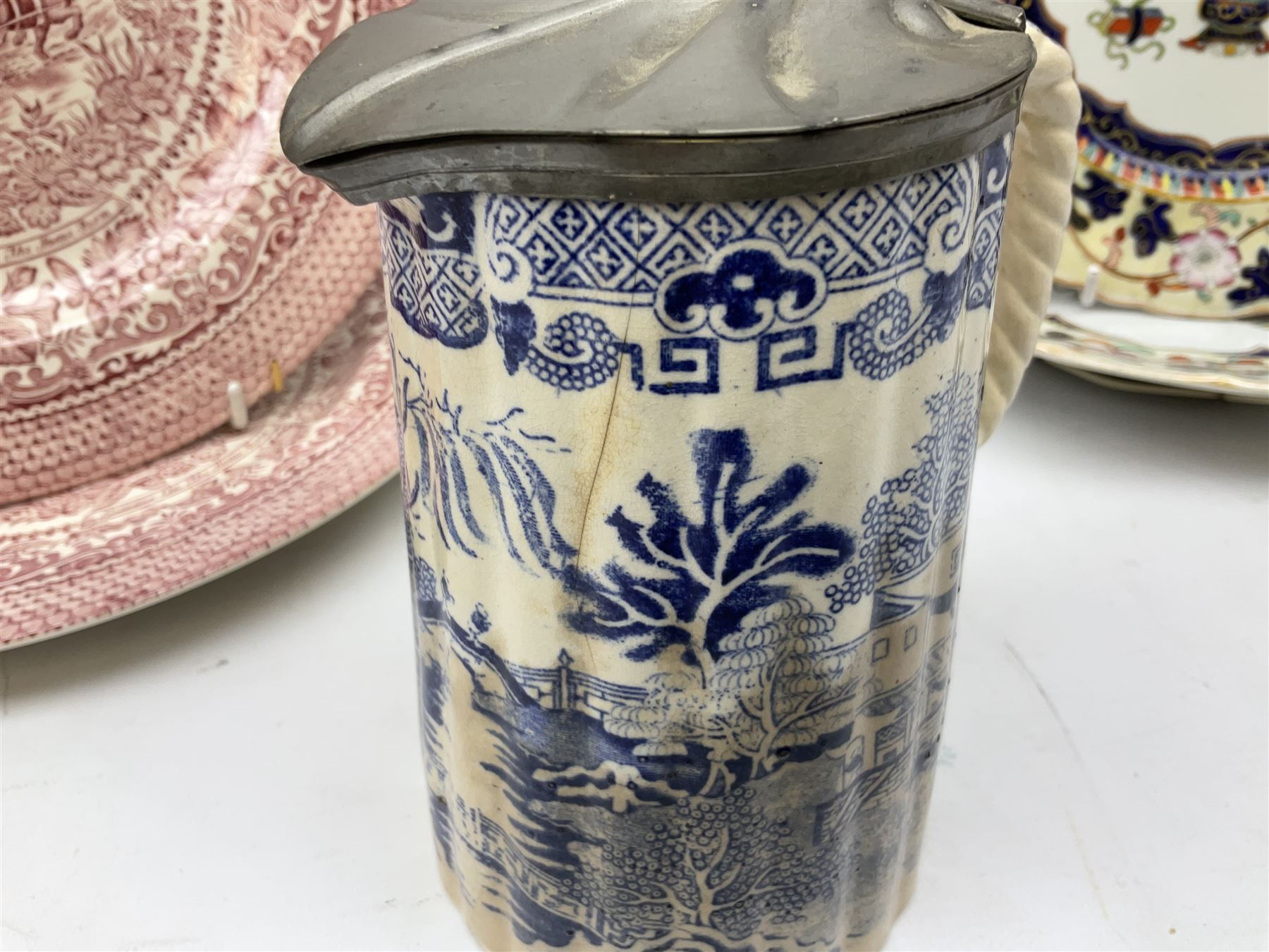 Four mid 19th century Mason's Ironstone plates decorated in the Chinese Antiquities pattern, the central circular panel decorated with footed vase with stylised motifs within a floral border, with gilt detail, pattern no. 1438, largest D26cm, together with Royal Worcester plate with floral decoration within green borders, blue and white tankard with pewter lid and teapot, teapot
