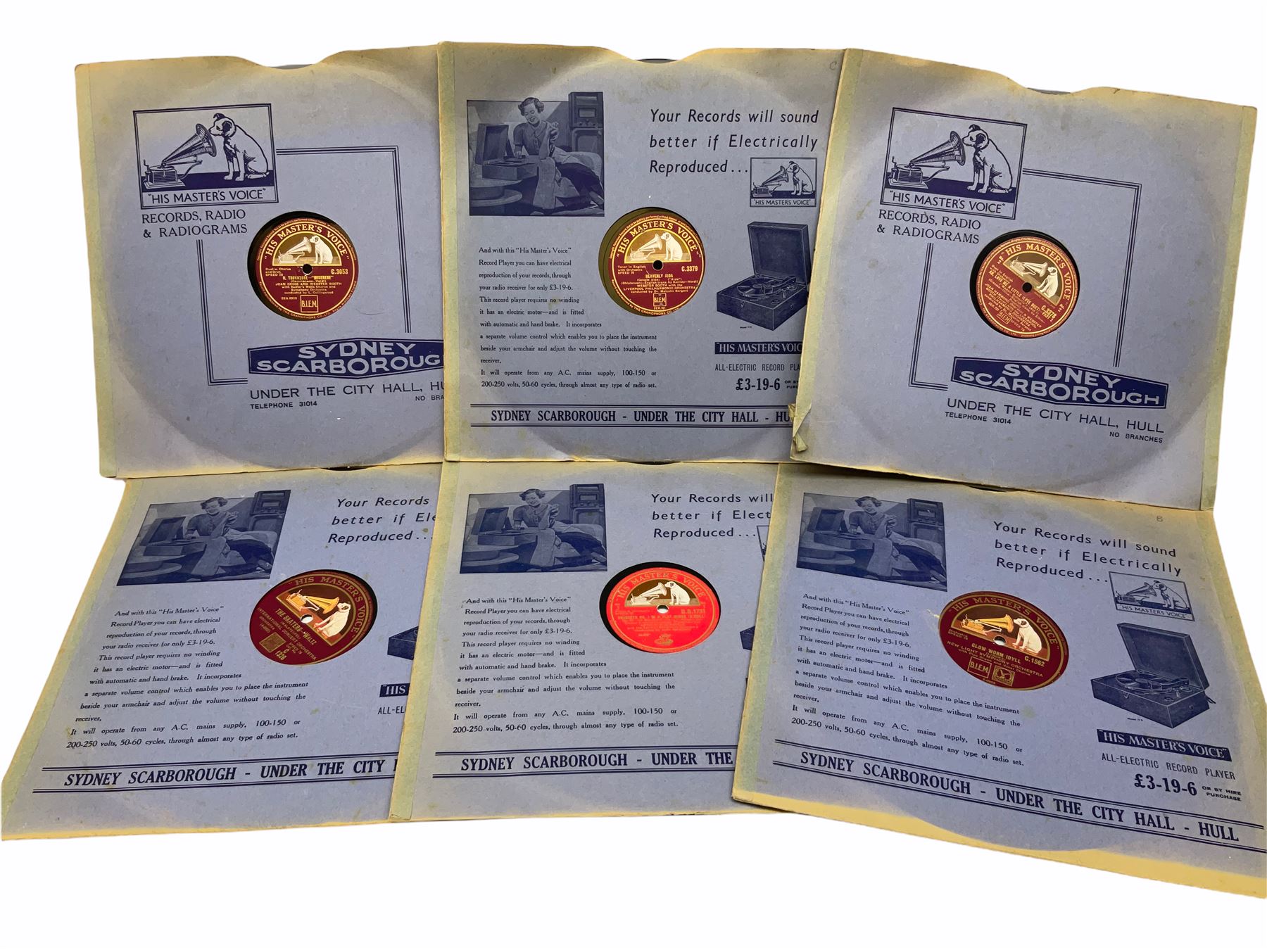 HMV portable wind up gramophone in a black case, together with a collection of records. 