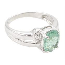 18ct white gold oval cut Paraiba tourmaline and round brilliant cut diamond ring, Birmingham 2006, tourmaline approx 1.80 carat