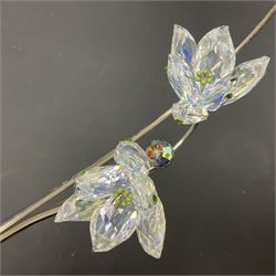 Eleven Swarovski Crystal flowers, to include violet, sunflower, delphinium, forget-me-not and lily-of-the-valley, each on stylised metal stems, tallest H23cm