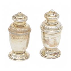 1930s three piece silver cruet set, comprising mustard pot with cover, salt and pepper shakers, together with 1960s toast rack and open salt, both hallmarked 