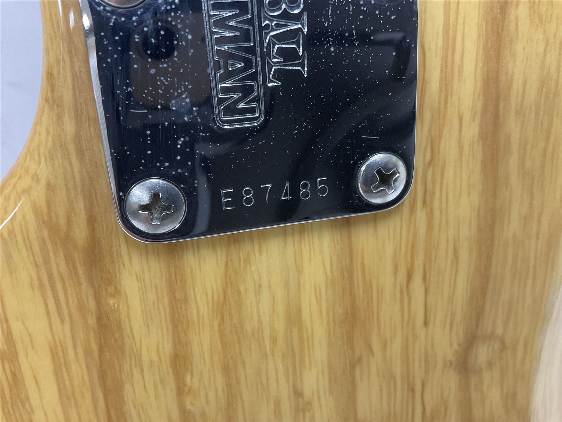 Ernie Ball Music Man Sting Ray 4 string bass guitar, in natural finish with roasted maple neck and tortoiseshell effect scratch guard, serial no 87485, in black Music Man hard case, guitar L114cm