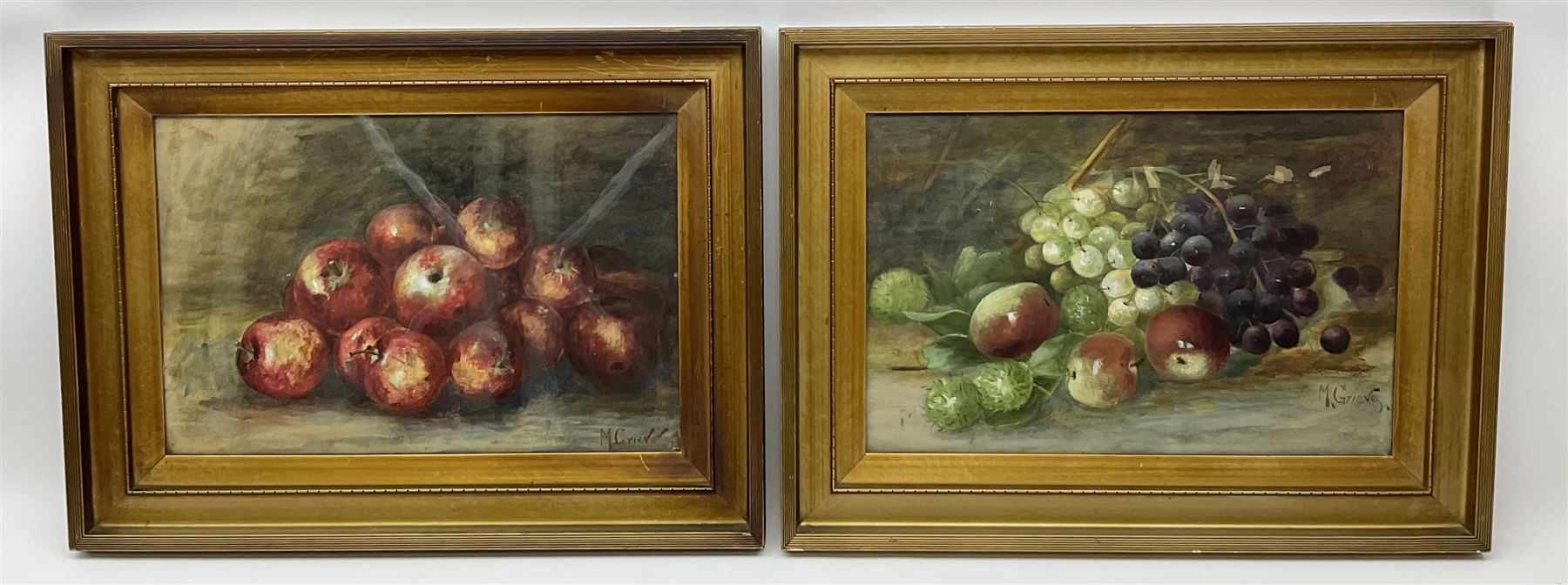 M Grieve (British 20th century): Still Life of Apples and Still Life of Mixed Fruit, pair pastel and watercolours signed 30cm x 45cm (2)