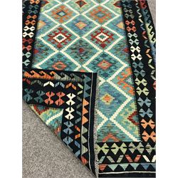 Choli Kilim blue ground rug, geometric patterned repeating border