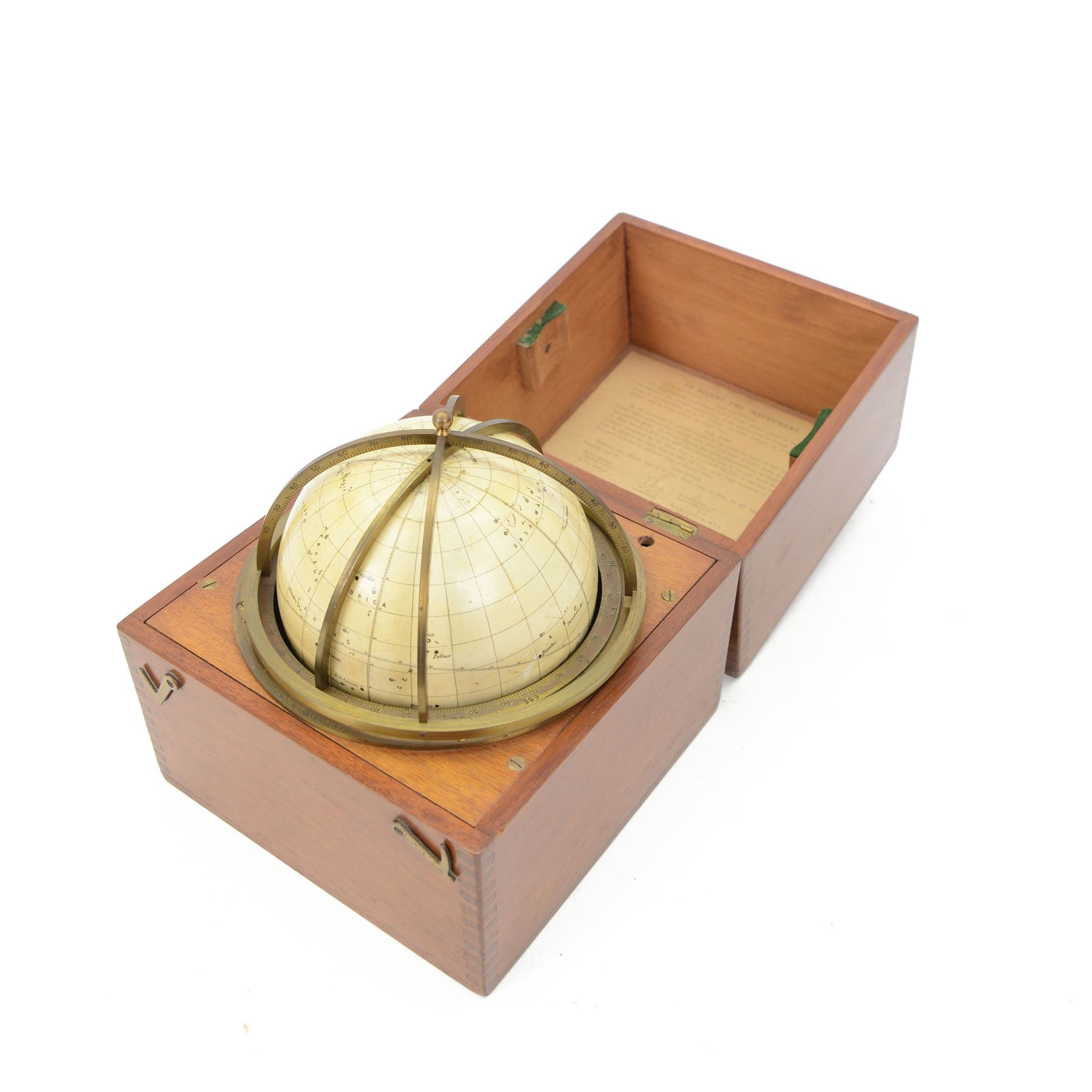 Cary Porter Ltd celestial navigational star globe patent no. 21450, the cream coloured sphere printed in black with stars and constellations, with brass meridian and horizon rings, contained within a fitted wooden box with paper instruction label to interior, globe diameter 11.5cm, box H21cm