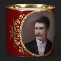 Late 19th century Vienna style coffee can and saucer, the cup with oval panel containing hand painted portrait of a gentleman, within a gilt foliate detailed surround, and upon a burgundy ground, the saucer with gilt band and sprigs upon a burgundy ground, with spurious shield mark beneath, cup H5cm saucer D12cm