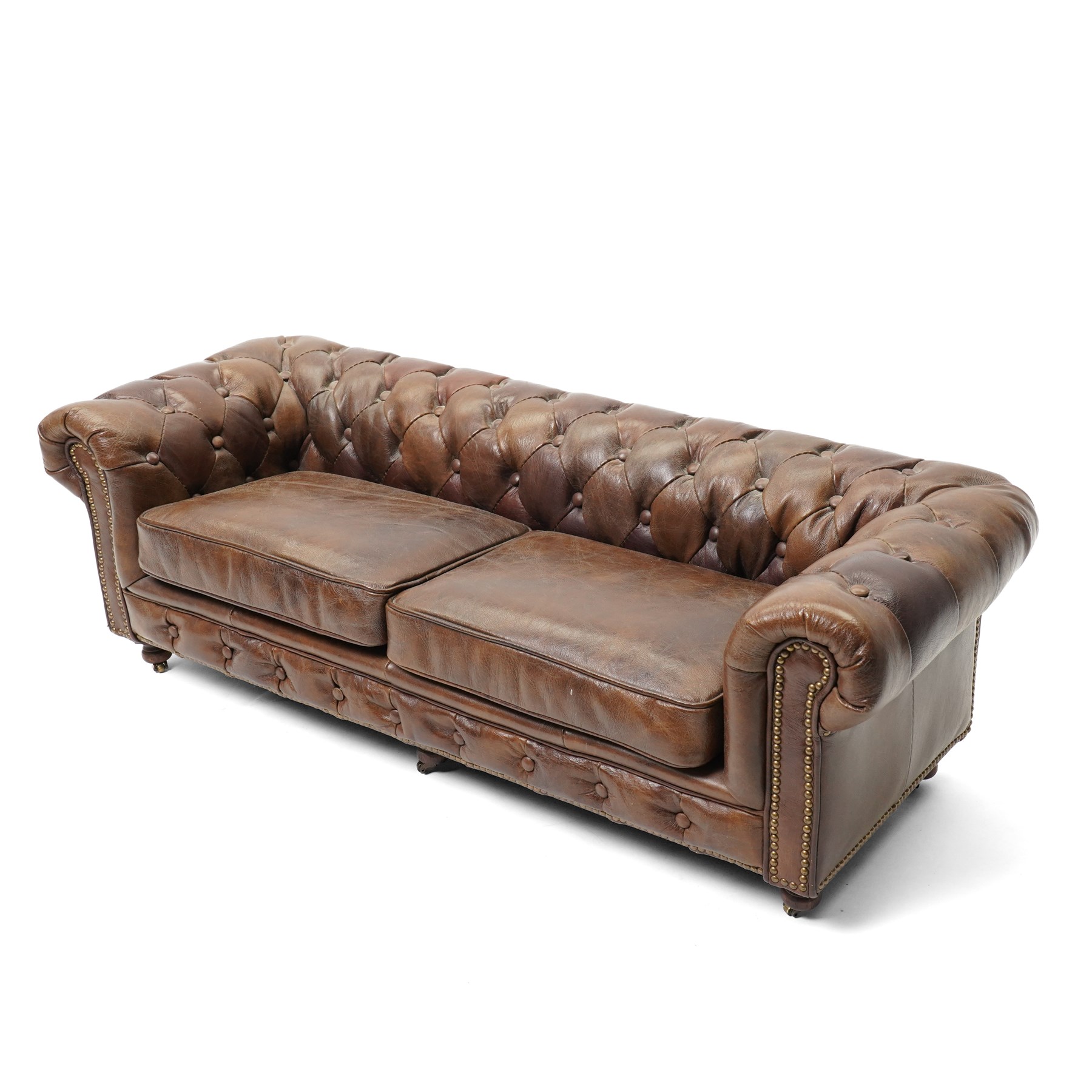 Miniature brown leather button back Chesterfield sofa, with castors 