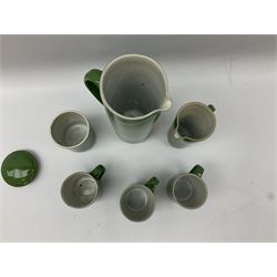 Rupert Spira (born 1960) stoneware coffee service decorated with vivid green glaze, comprising coffee pot, three cups, lidded sucrier and milk jug, all having impressed RS marks beneath, tallest H25cm