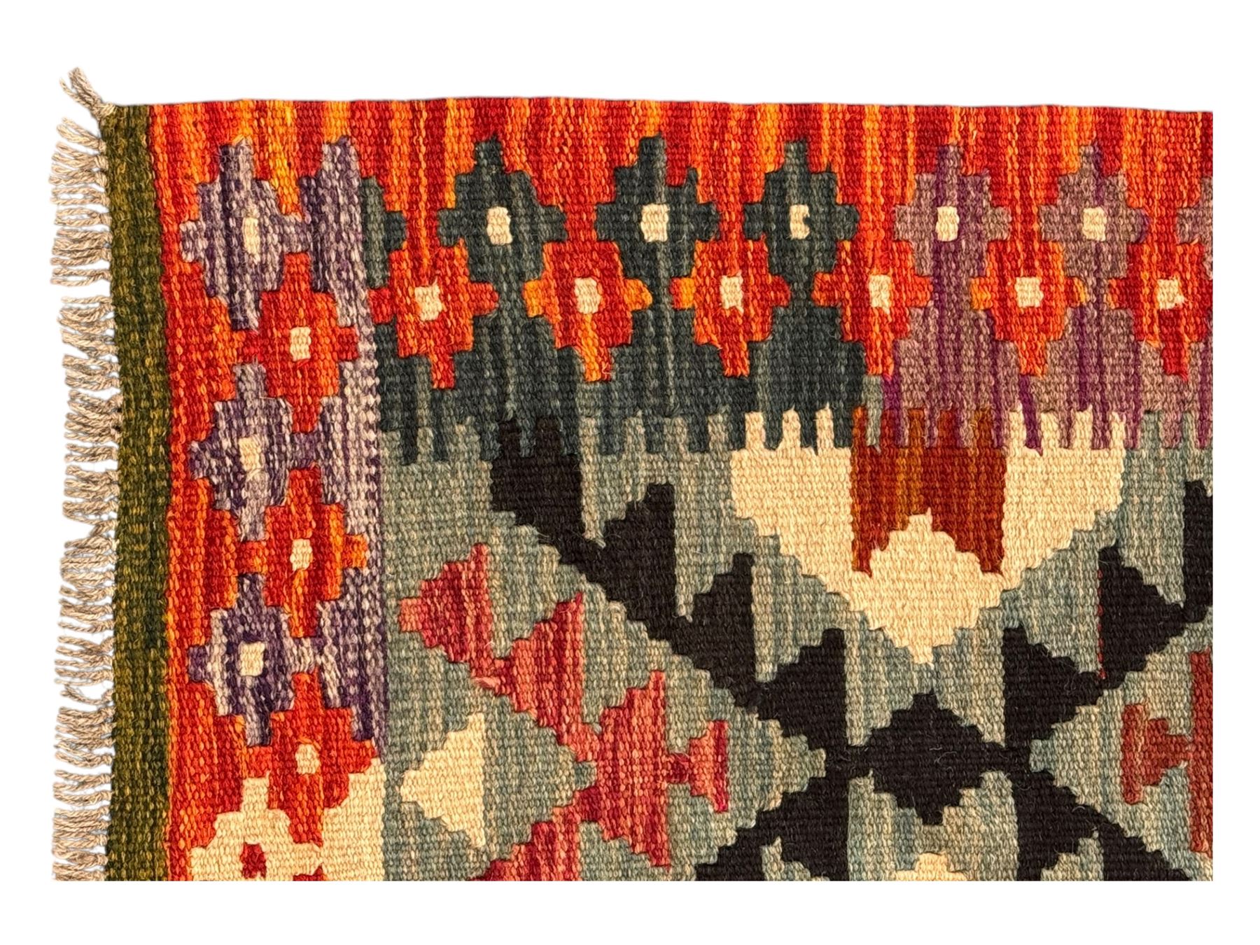 Afghan Maimana Kilim flatweave runner, handwoven with a deep teal ground showcasing a vibrant multicoloured diamond-lattice design in the traditional Maimana style, enclosed by stylised borders and finished with fringed edges 